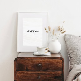 a side table next to a bed