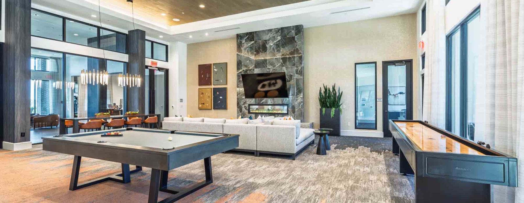 Community Space with Pool table, fireplace, and Shuffleboard table