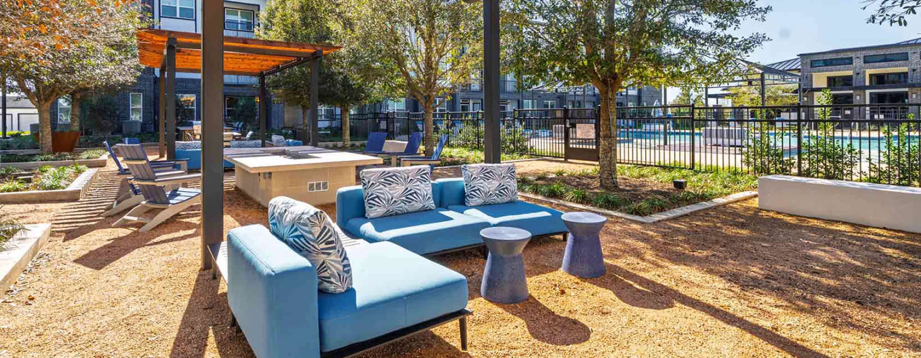 an outdoor lounge with couches