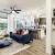 living area with blue couch with open floorplan