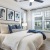 Spacious bedroom with queen size bed with blue pillows